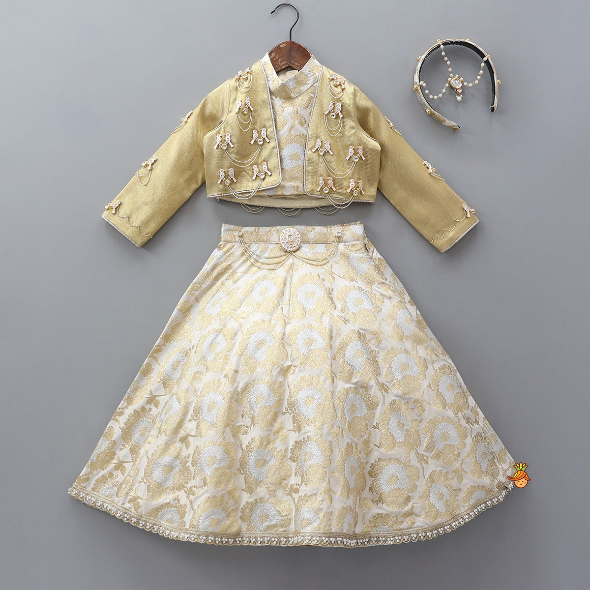 Exquisite Halter Neck Brocade Top With Embellished Jacket And Brocade Lehenga With Matching Hair Band
