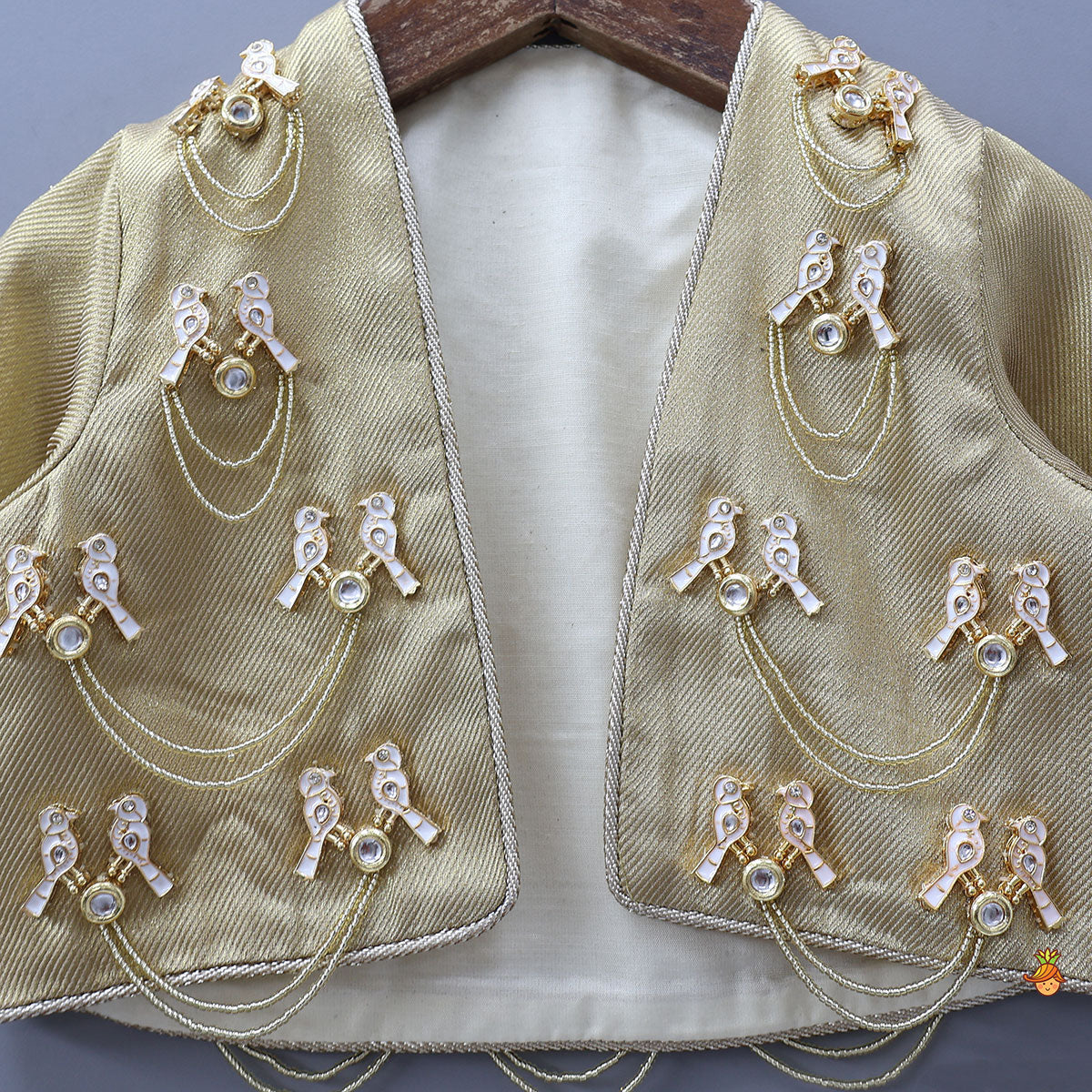 Exquisite Halter Neck Brocade Top With Embellished Jacket And Brocade Lehenga With Matching Hair Band