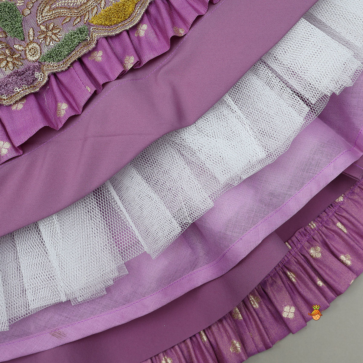 Pleated Armhole Top And Shimmery Lehenga With Matching Net Dupatta