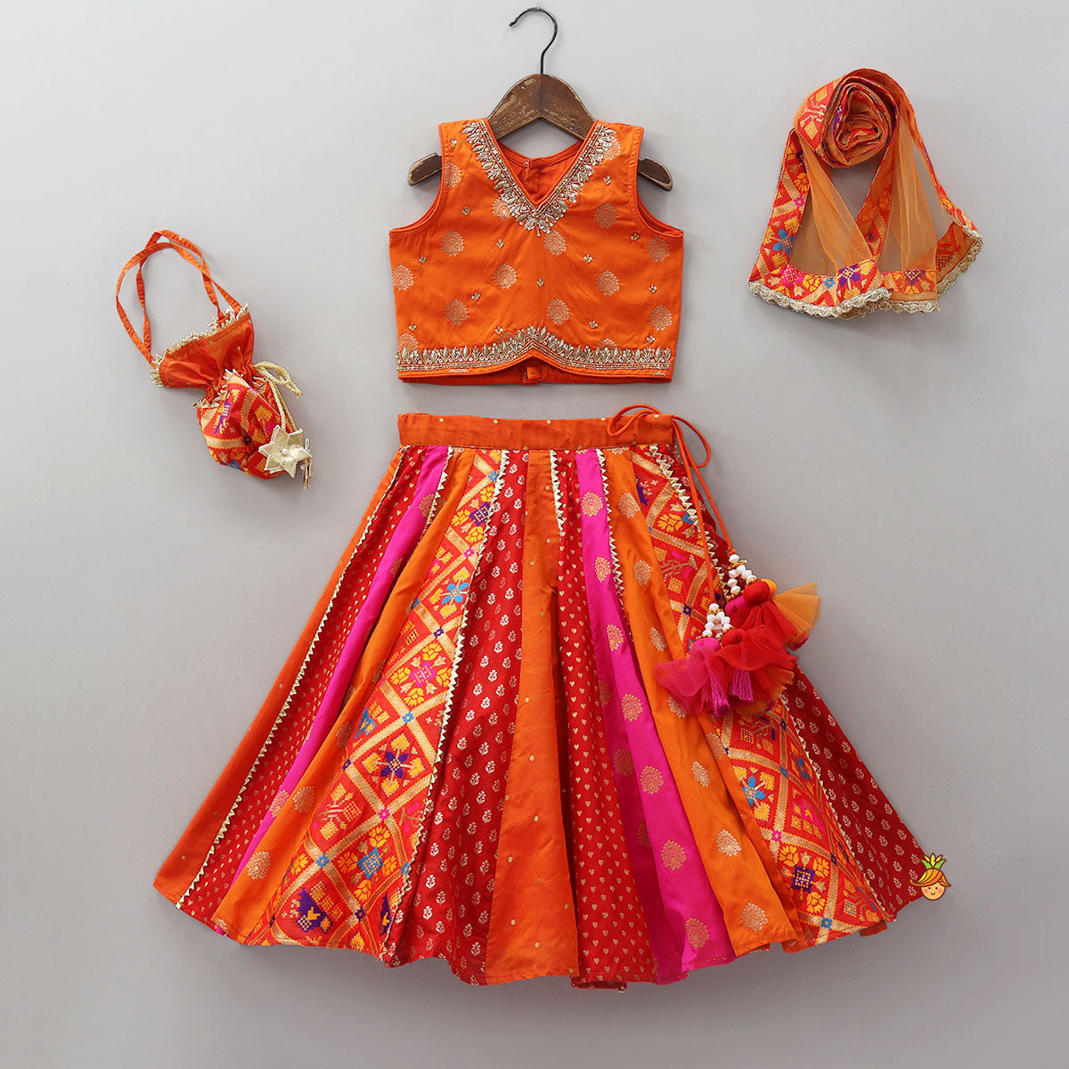 Embroidered Elegant Top And Brocade Lehenga With Matching Net Dupatta And Brocade Potli Bag