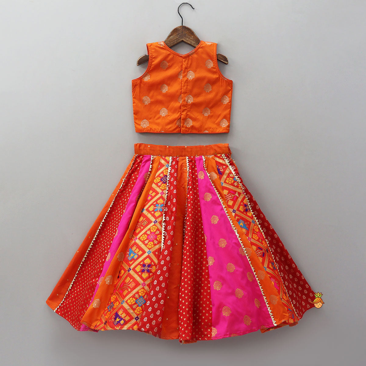Embroidered Elegant Top And Brocade Lehenga With Matching Net Dupatta And Brocade Potli Bag