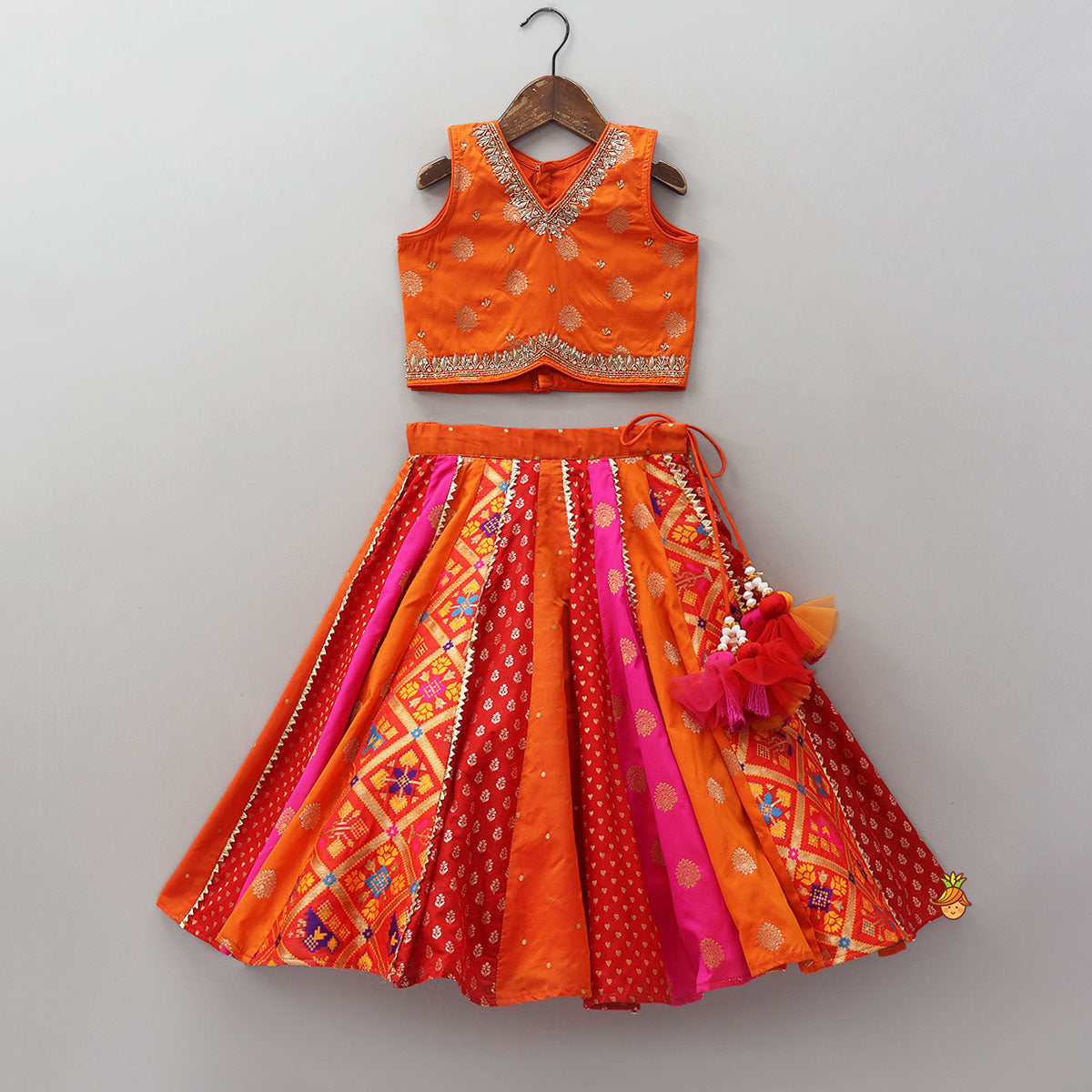 Embroidered Elegant Top And Brocade Lehenga With Matching Net Dupatta And Brocade Potli Bag