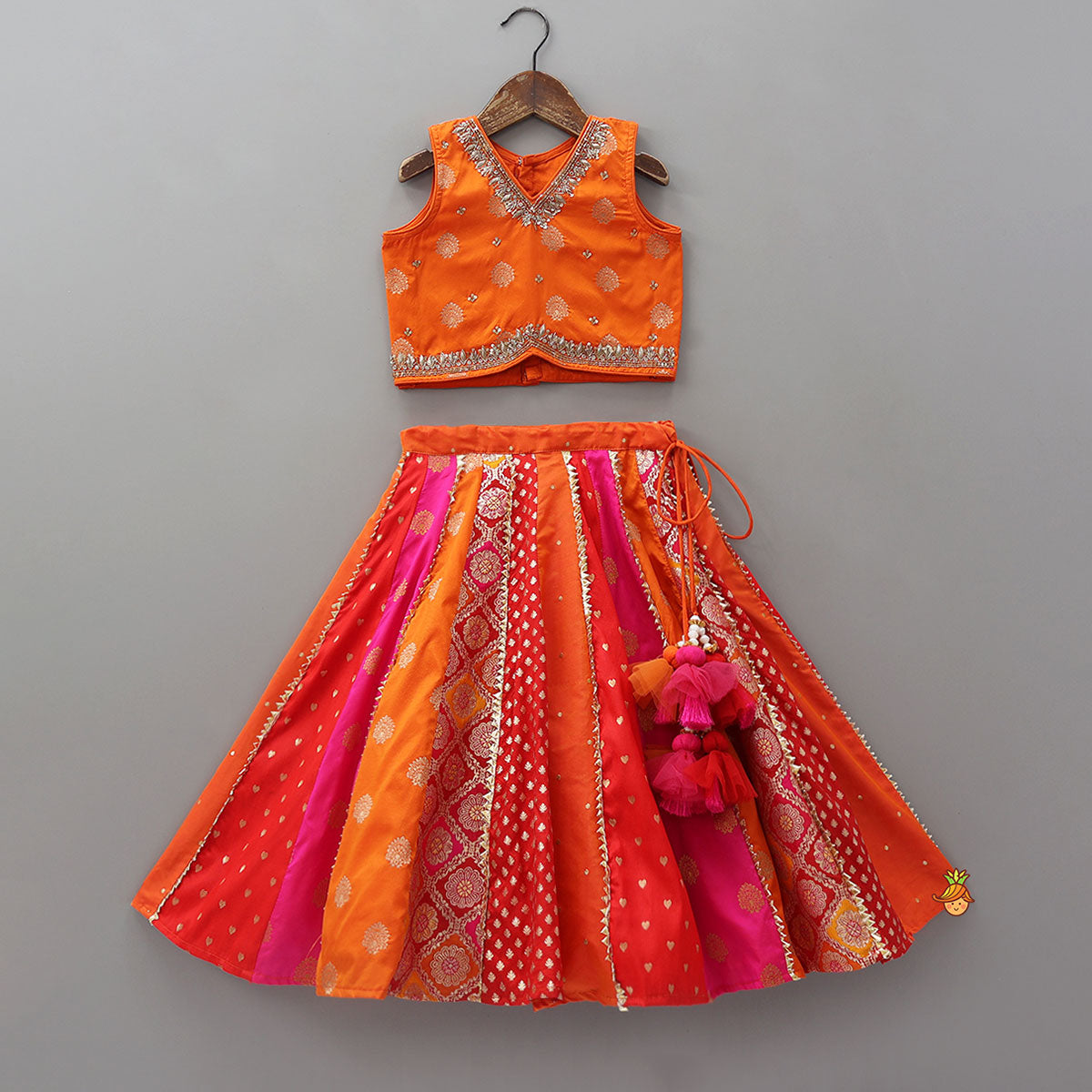 Embroidered Elegant Top And Brocade Lehenga With Matching Net Dupatta And Brocade Potli Bag