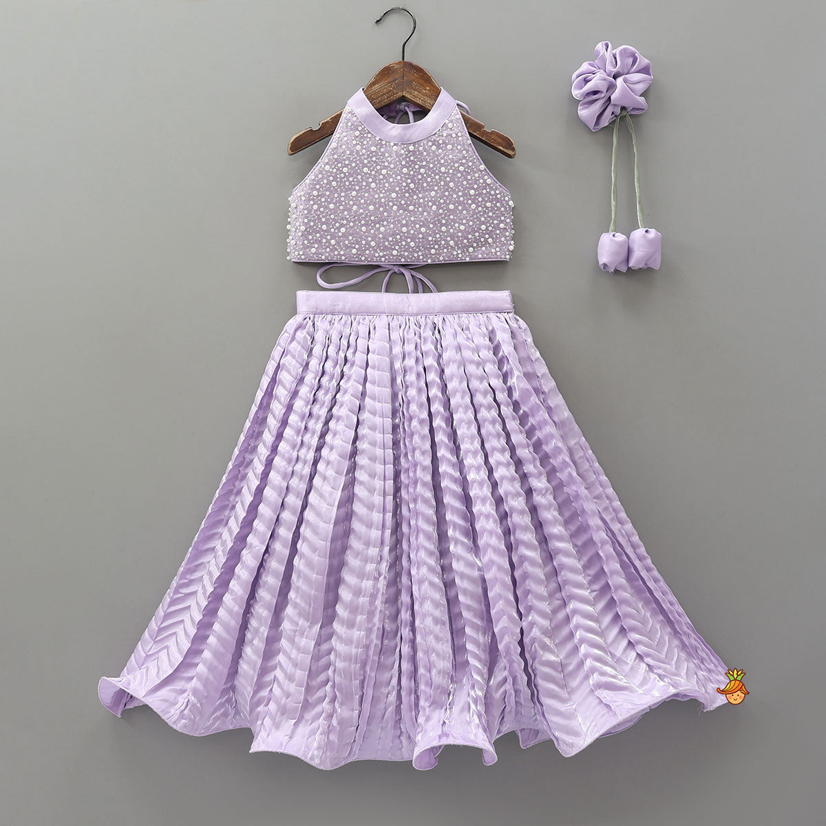 Stunning Criss-Cross Back Knot Top And Crushed Sheen Lehenga With Matching Hair Tie