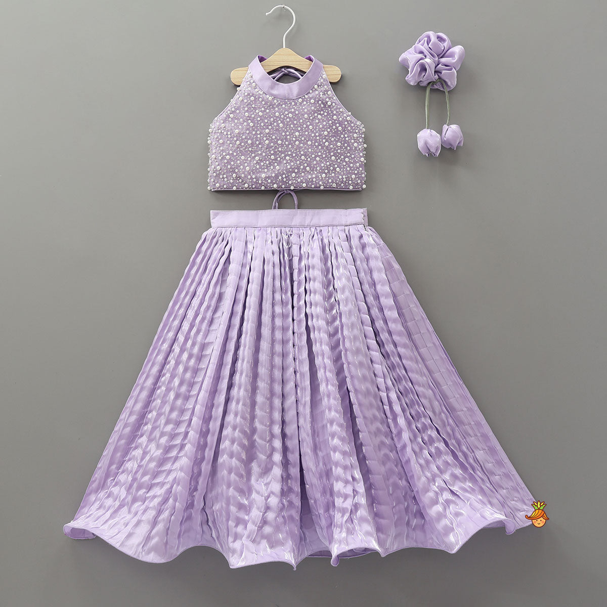 Stunning Criss-Cross Back Knot Top And Crushed Sheen Lehenga With Matching Hair Tie