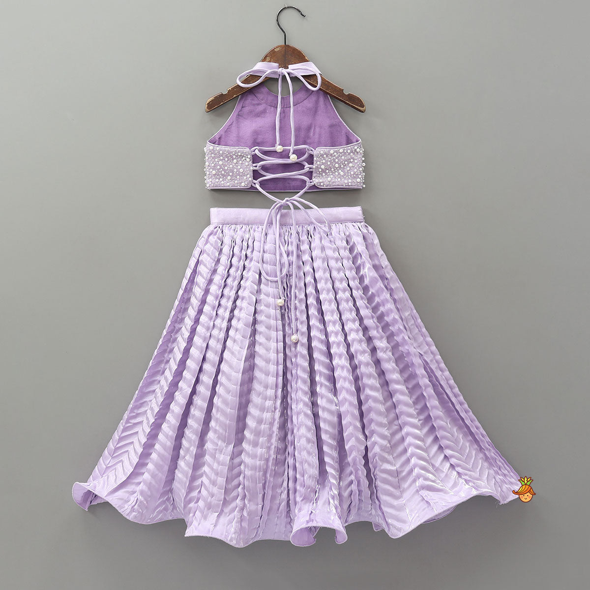 Stunning Criss-Cross Back Knot Top And Crushed Sheen Lehenga With Matching Hair Tie