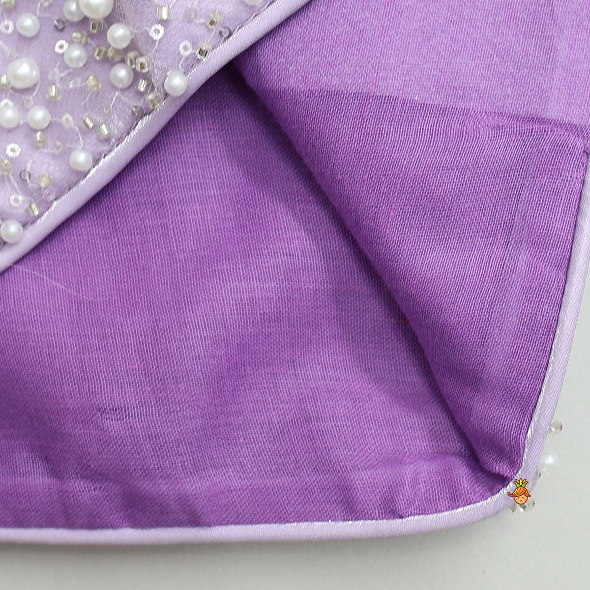 Stunning Criss-Cross Back Knot Top And Crushed Sheen Lehenga With Matching Hair Tie