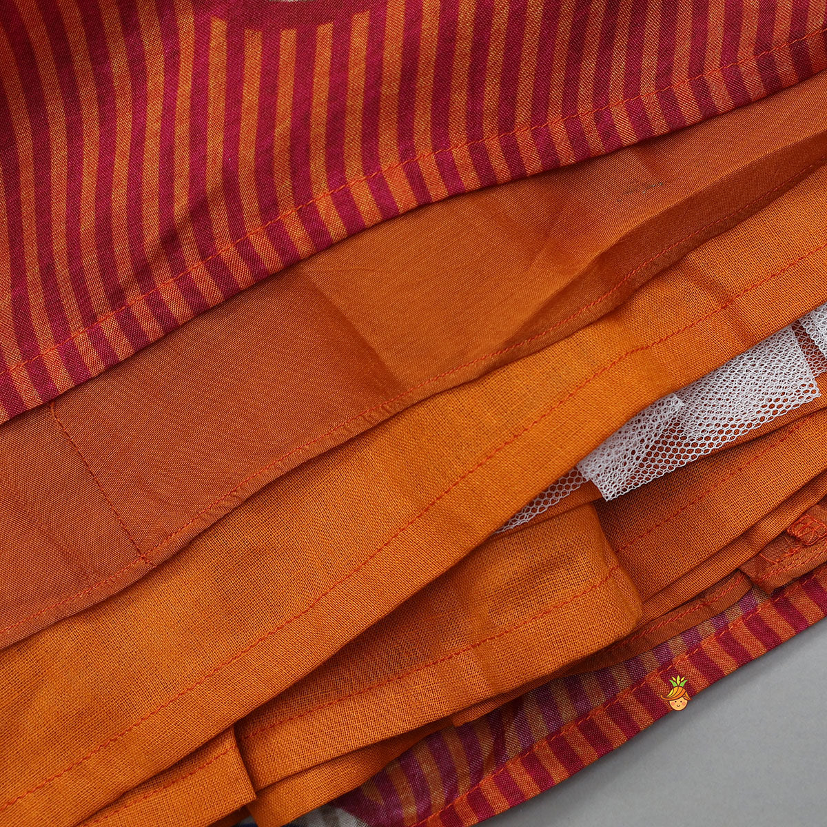 Fringes Adorned Striped Crop Top With Printed Lehenga
