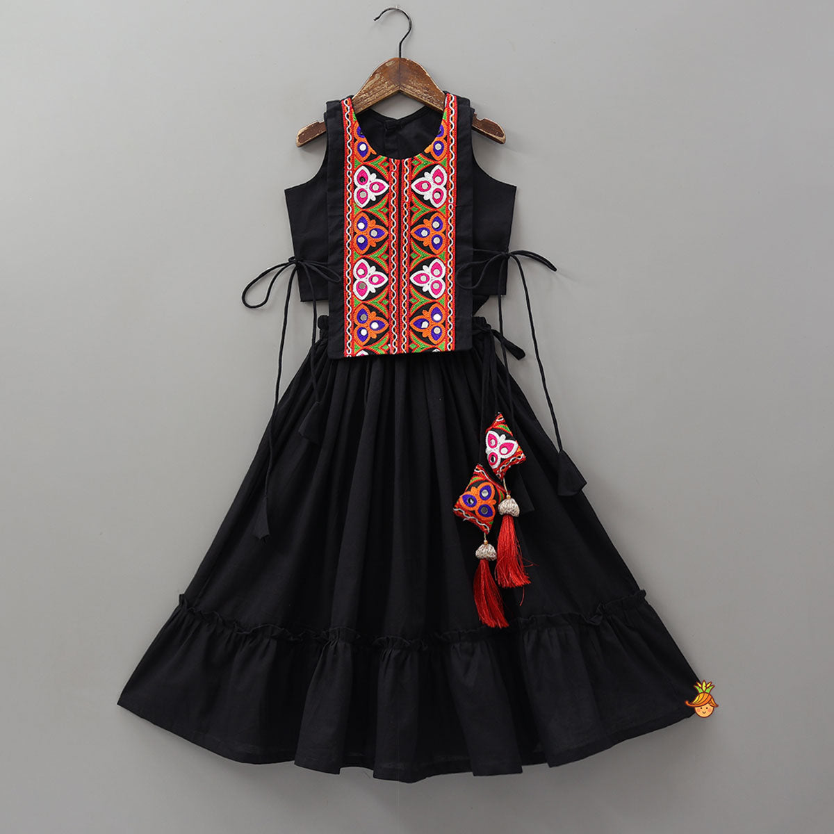 Top With Embroidered Overlay Cape And Tassel Detailed Flared Lehenga
