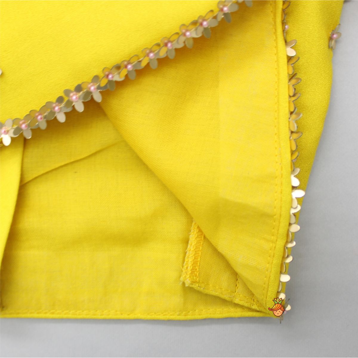 Floral Sequined Yellow Top And Cow Tassels Enhanced Pleated Lehenga With Dupatta