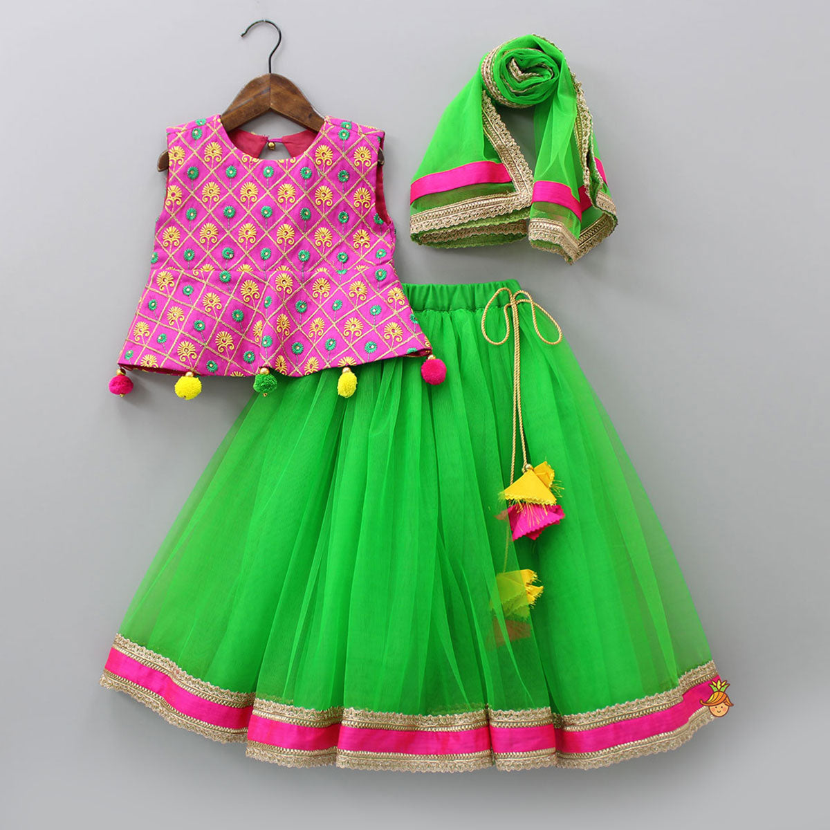 Pre Order: Embroidered Pink Peplum Top And Green Net Lehenga With Matching Dupatta