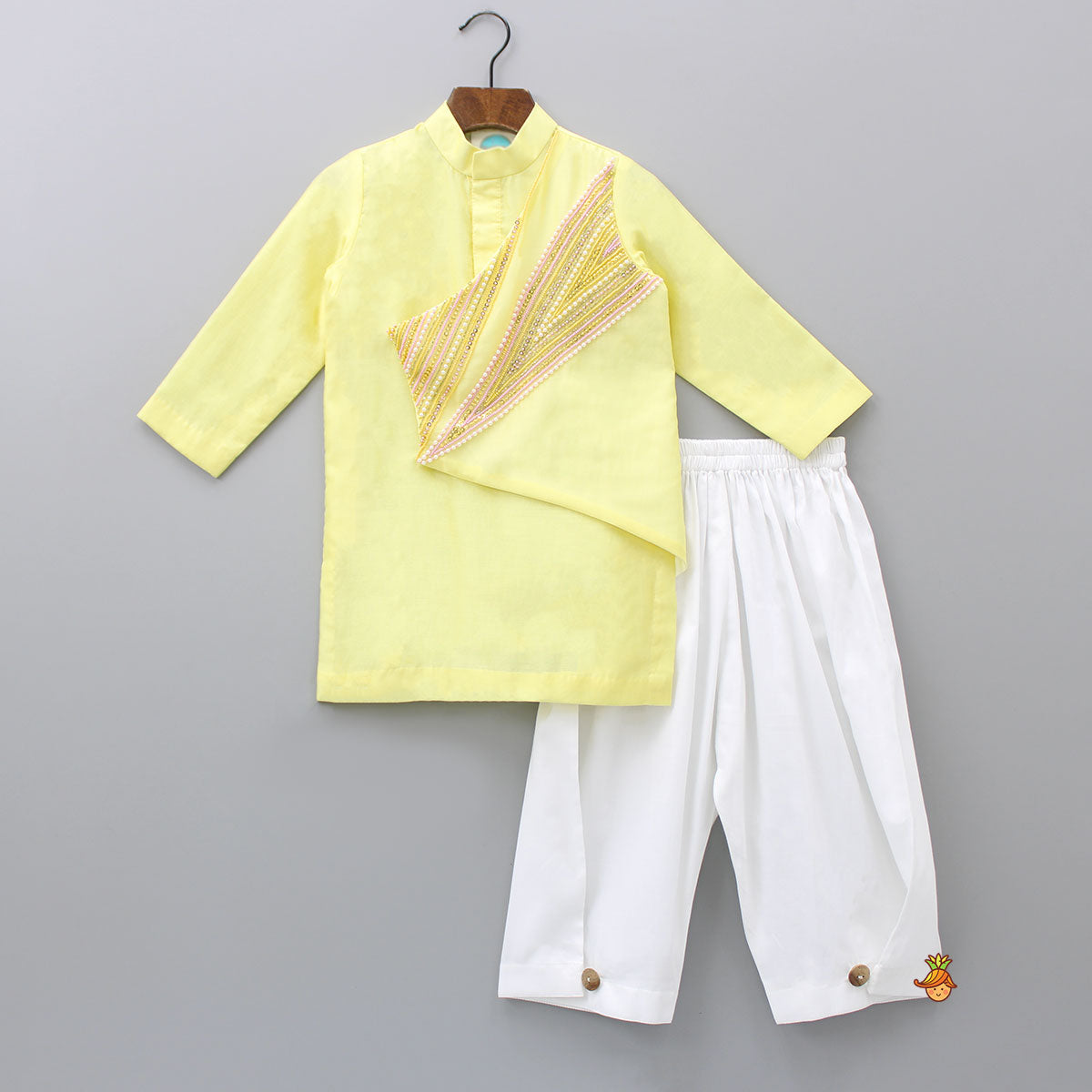 Pre Order: Beautiful Embroidered Yellow Flap Kurta And Button Adorned Stylish Pyjama