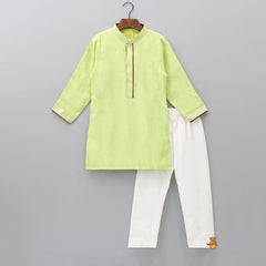Pre Order: Green Kurta With Hanging Chain Brooch Enhanced Jacket And Pyjama