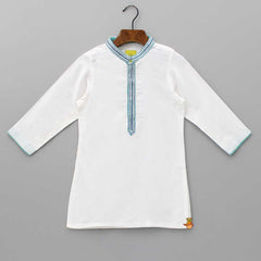 Pre Order: Embroidered Front Placket White Kurta With Pocket Detail Blue Jacket And Pyjama