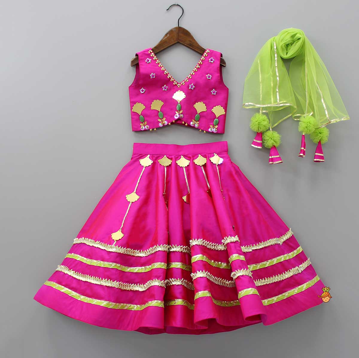Pre Order: Stylish Cut Out Hem Pink Sleeveless Top And Lehenga With Contrasting Net Dupatta