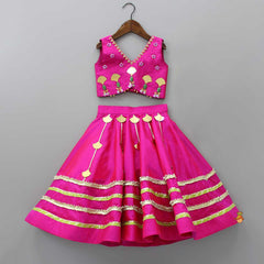 Pre Order: Stylish Cut Out Hem Pink Sleeveless Top And Lehenga With Contrasting Net Dupatta