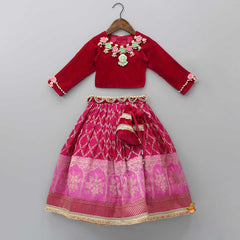 Pre Order: Stone Studded Pink Velvet Top And Embroidered Lehenga With Matching Dupatta And Potli Bag