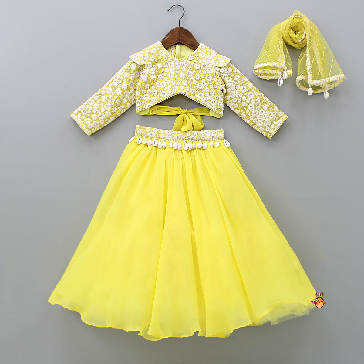 Pre Order: Stylish Cut Out Back Yellow Top And Lehenga With Net Dupatta
