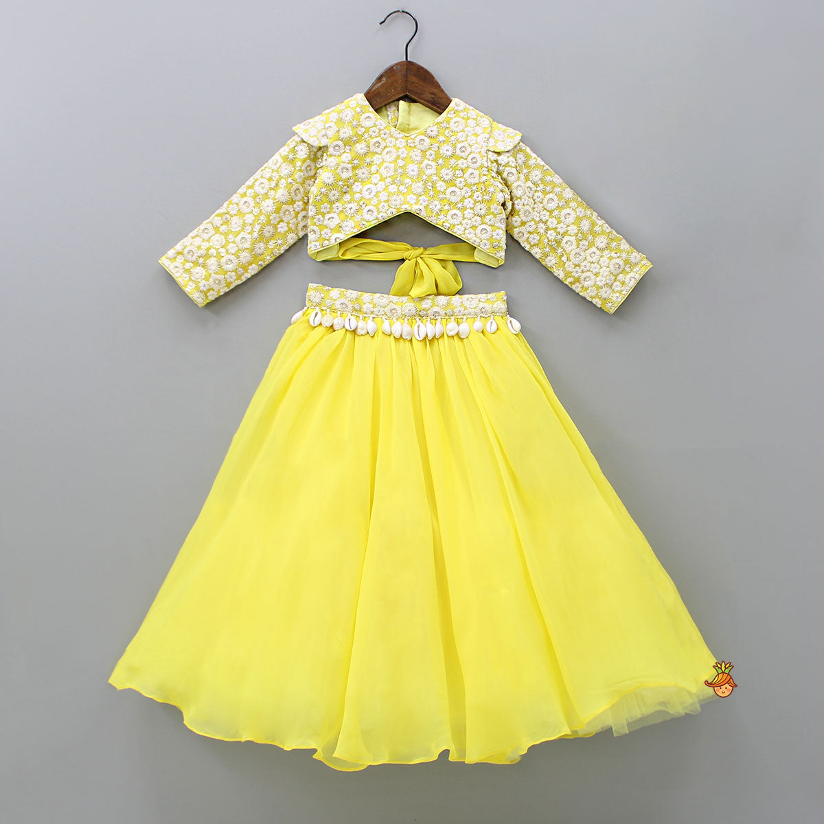 Stylish Cut Out Back Yellow Top And Lehenga With Net Dupatta