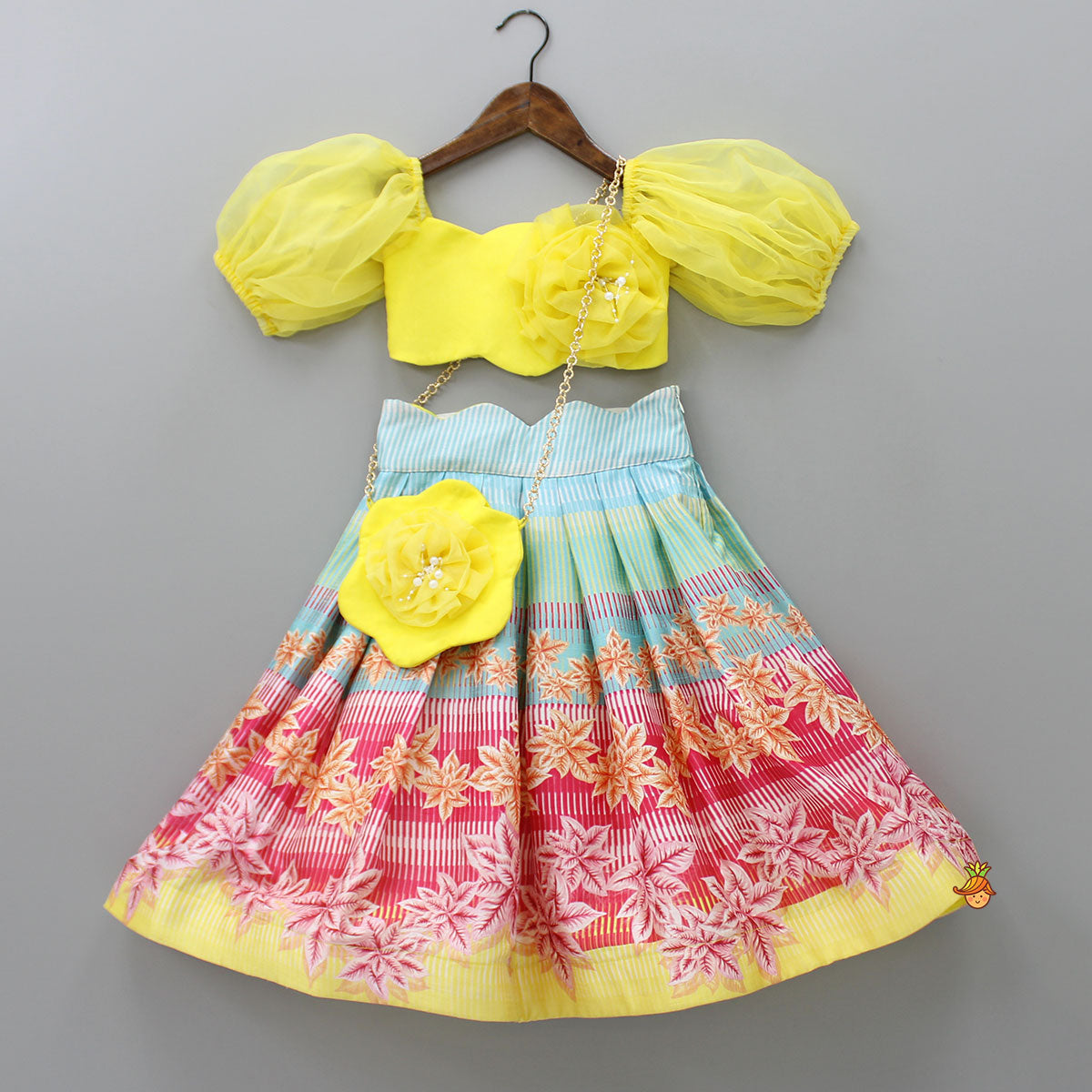 Pre Order: Scalloped Neck Yellow Organza Top And Printed Lehenga With Floral Sling Bag