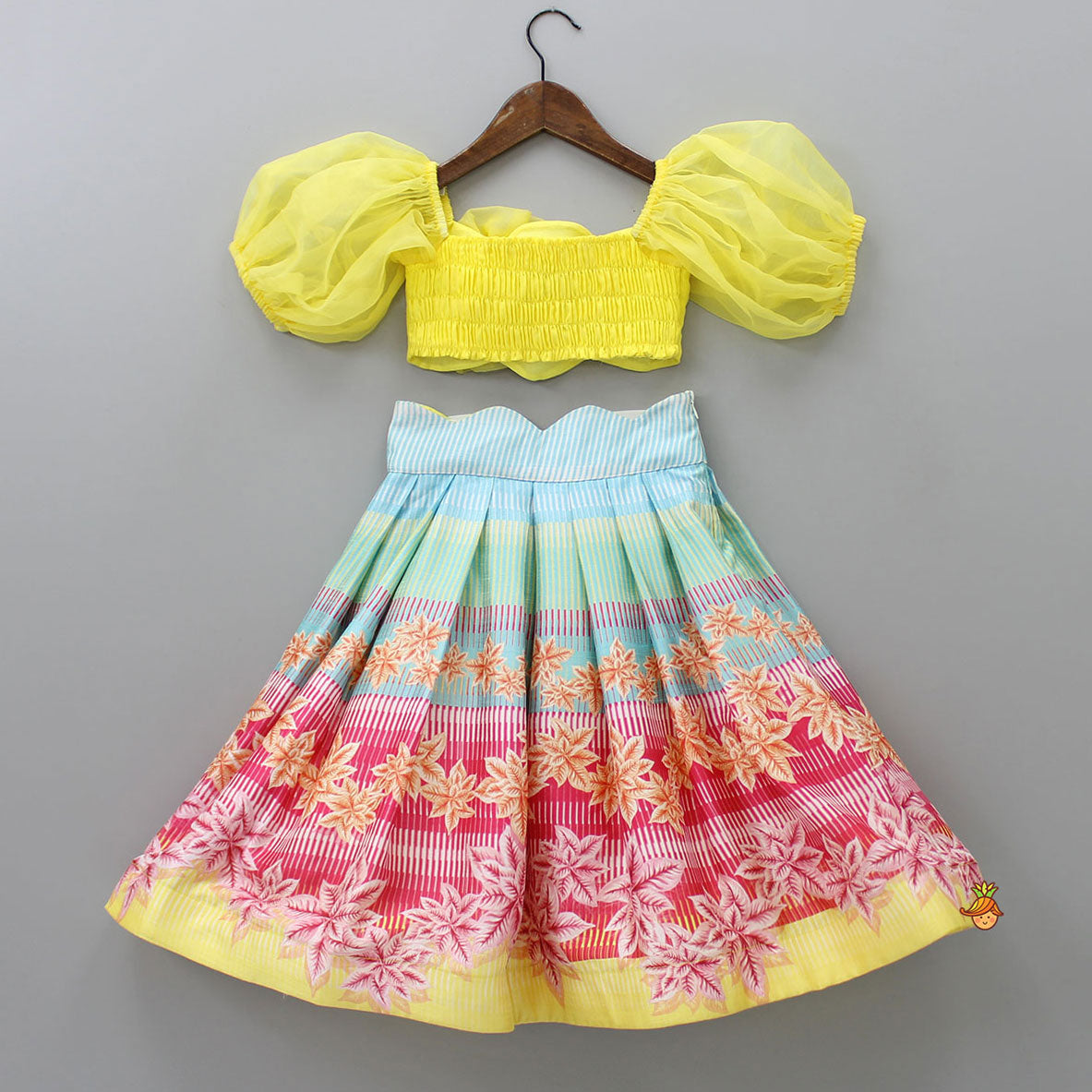 Scalloped Neck Yellow Organza Top And Printed Lehenga With Floral Sling Bag