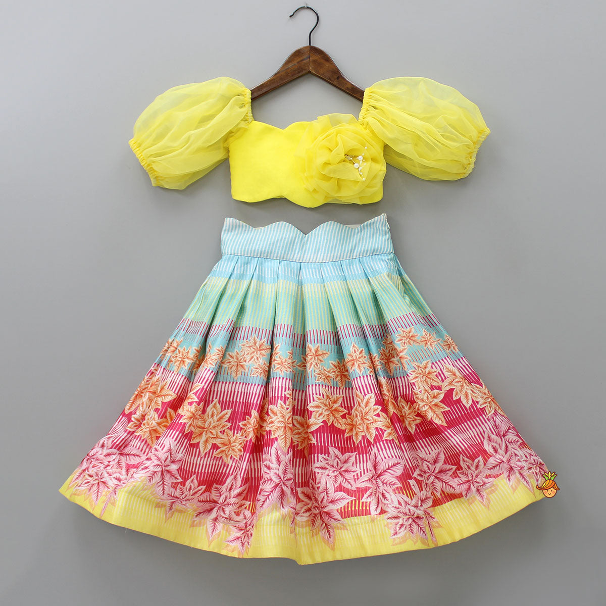Scalloped Neck Yellow Organza Top And Printed Lehenga With Floral Sling Bag